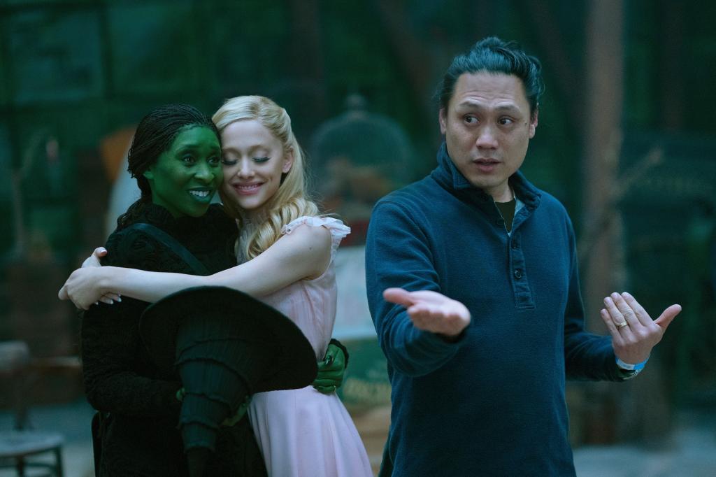 Ariana Grande and Cynthia Erivo hugging on "Wicked" while Jon M. Chu directs