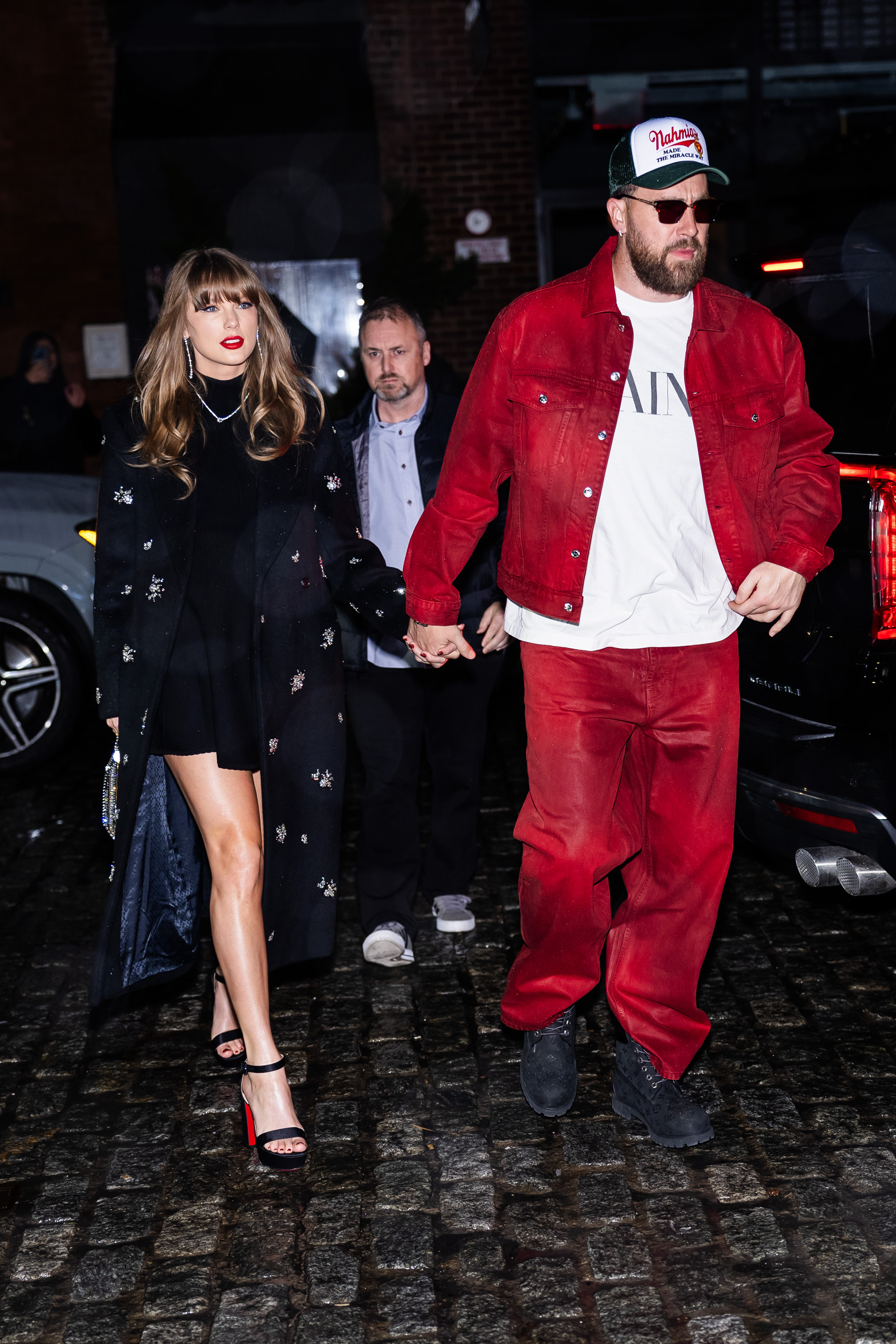 Taylor Swift (L) and Travis Kelce are seen in the Meatpacking District on December 28, 2024 in New York City.