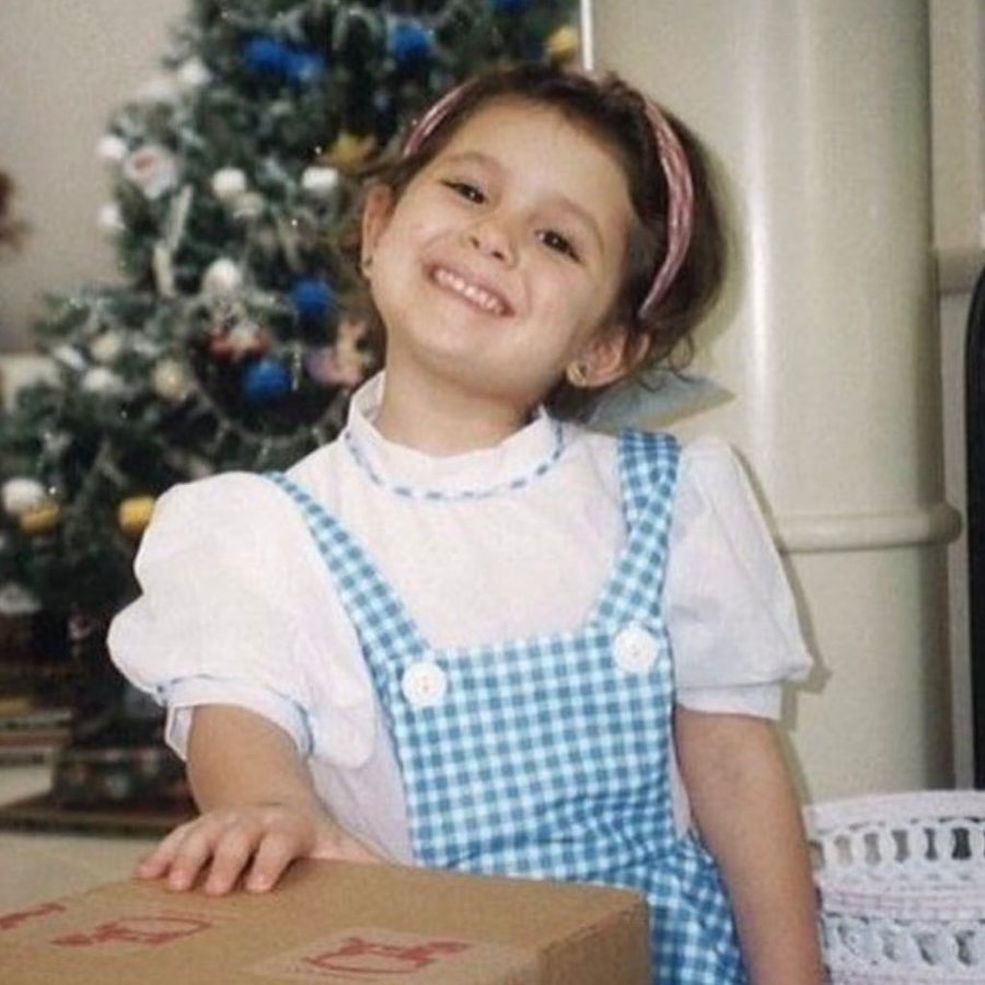 A throwback photo of Ariana Grande dressed in a "Wizard of Oz" Dorothy dress as a child
